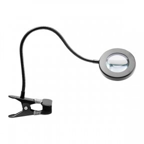 Кольцевой светильник LED SNAKE RING, установленный на столе.